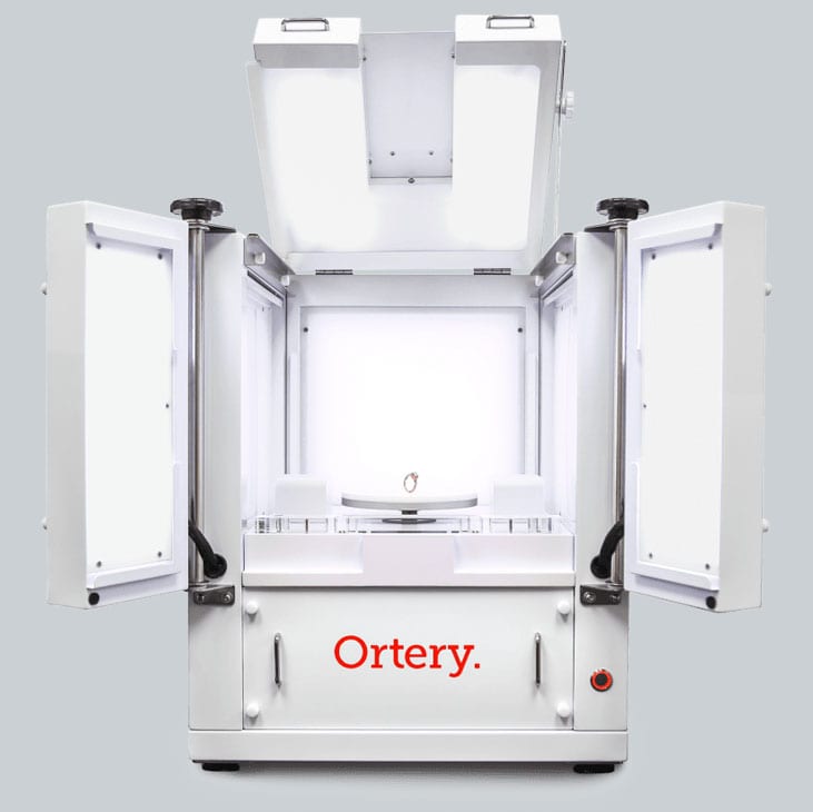 Ortery 3D PhotoBench 80 Air jewelry and loose stone photography lightbox with a bottom lit turntable and suction for creating standing, still photos for the web.